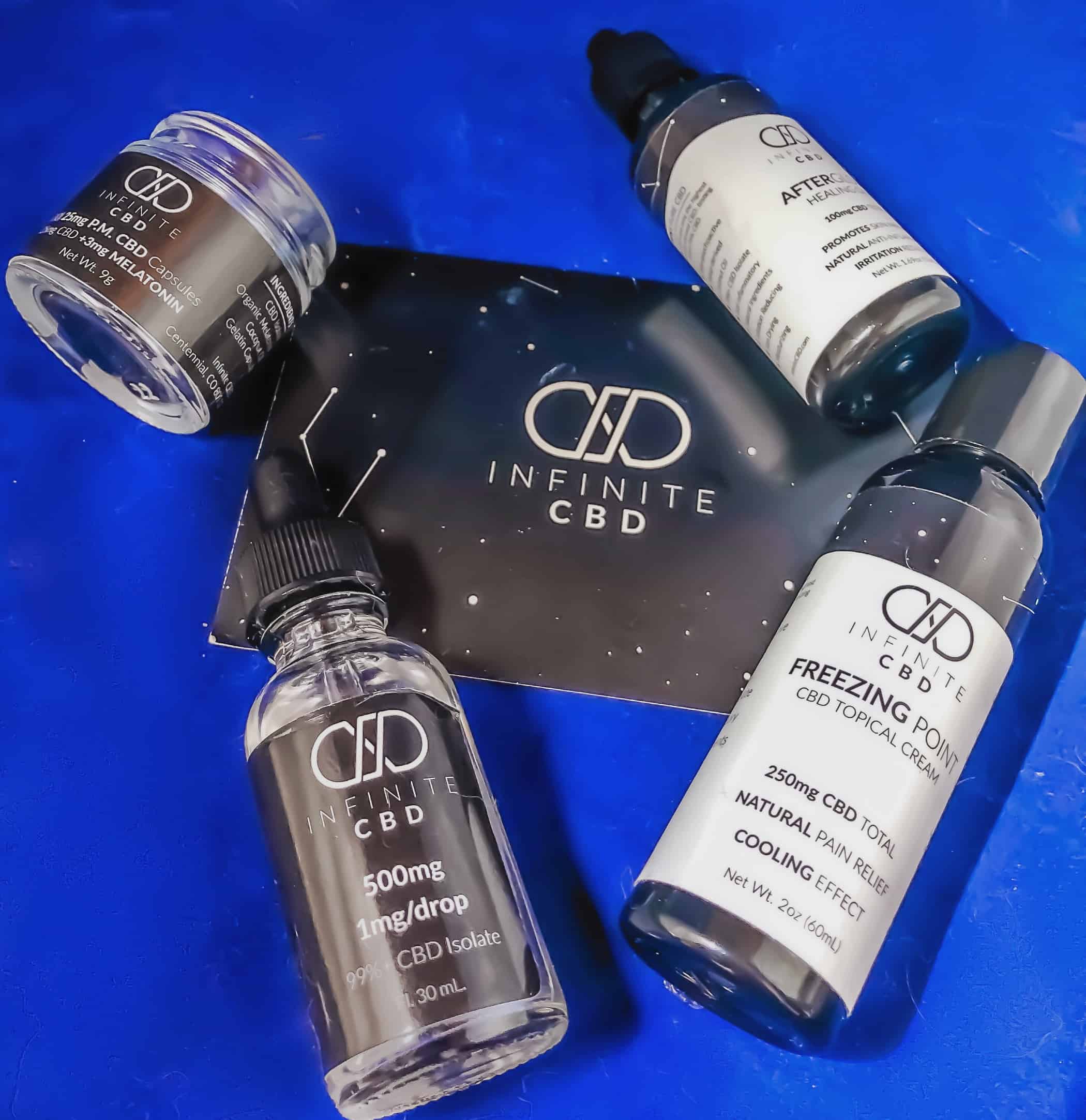 Infinite CBD products against a blue backdrop.