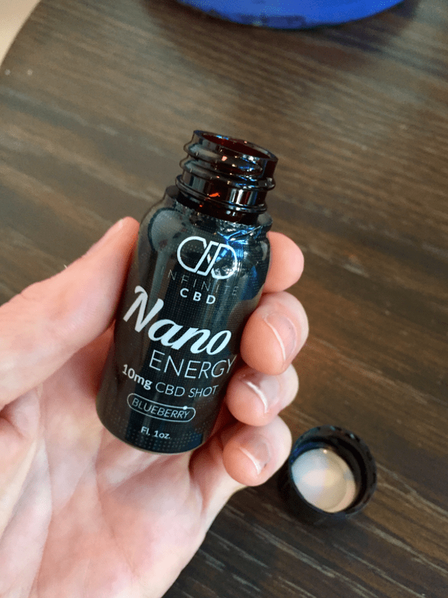 Infinite CBD Review - Nano Energy Shot - Hands - Save On Cannabis