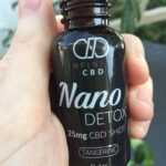 Infinite CBD Review - Save On Cannabis - Nano Shot Detox - In Hand Shot