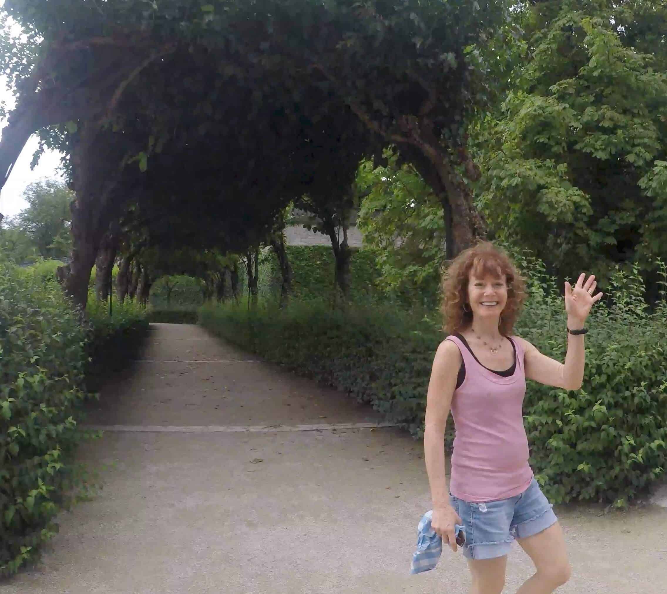 Rena waving handing while walking